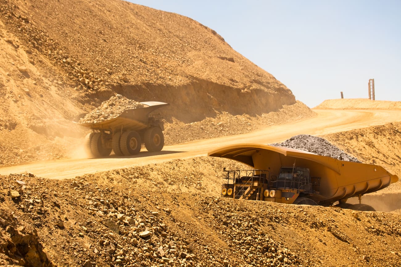 Haul trucks loaded with copper ore at an open pit mine